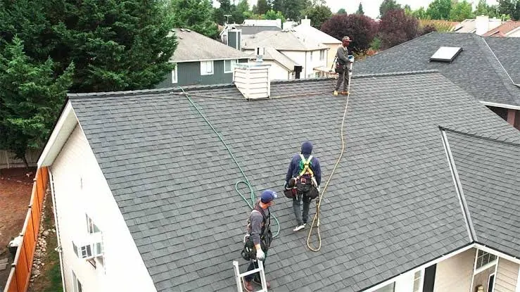Roofing crew working on a residential roof
